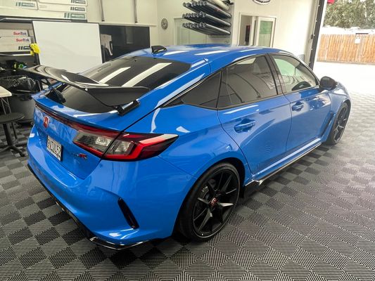 Blue Honda Civic Type R with ceramic tint in the shop