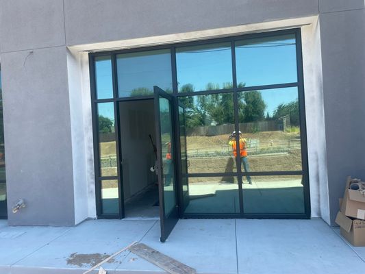 Completed commercial storefront window tint — exterior view