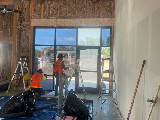 Interior view of commercial window film installation in progress
