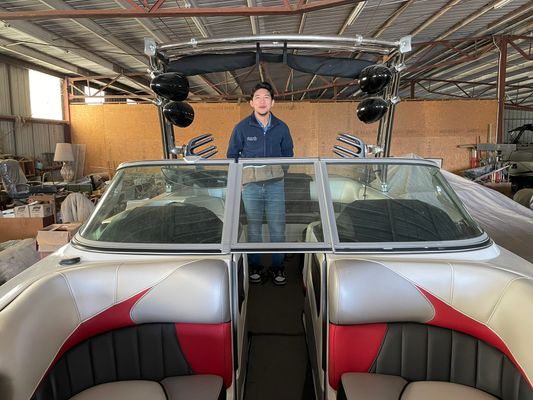 Wakeboard boat windshield tint installation in progress